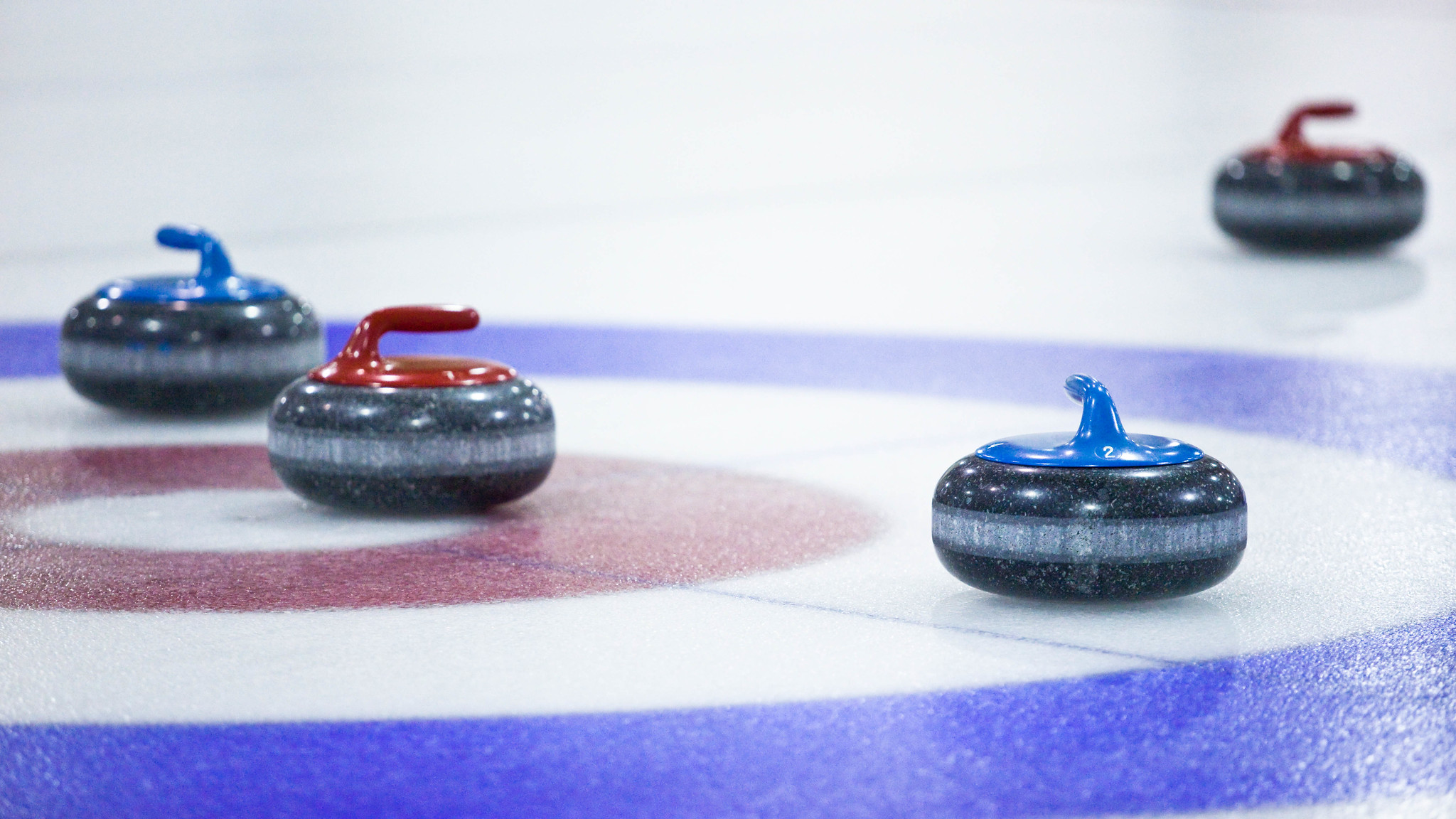 The Strange Asymmetry of Curling